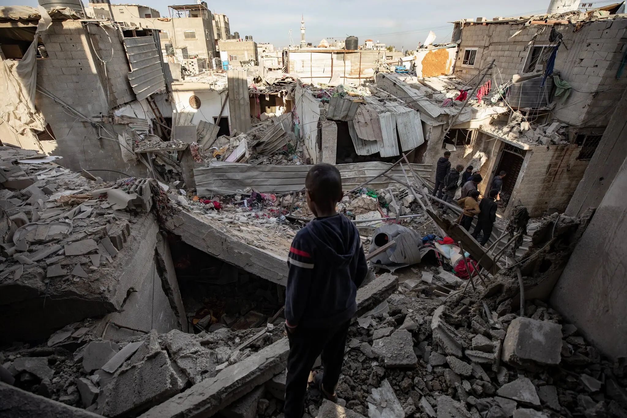 A child in a building destroyed by the occupation in Rafah, captured by Haitham Emad (Shutterstock)
